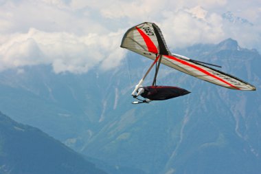 Hang gliding in Swiss Alps clipart