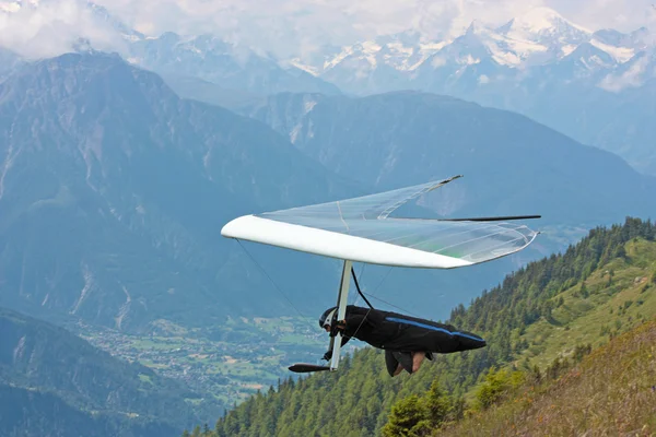 Hang gliding in Swiss Alps Stock Photo