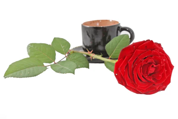 Koffiekopje en rode rose — Stockfoto
