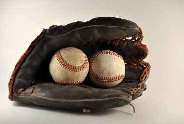 Old Baseball Glove With Baseballs clipart