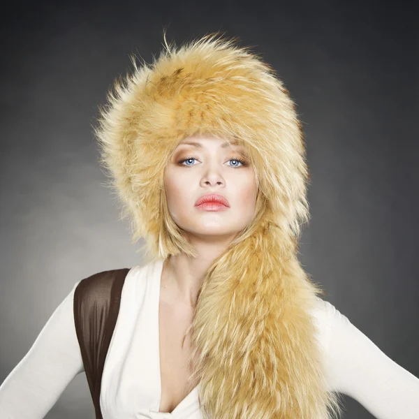 stock image Young woman in fur hat