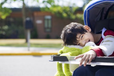 Five year old disabled boy going to school clipart