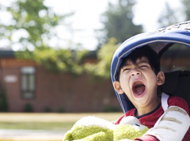 Five year old disabled boy going to school clipart