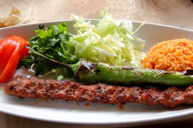 Adana Kebab with dressing clipart