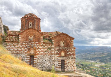 Orthodox Byzantine style church above Berat clipart