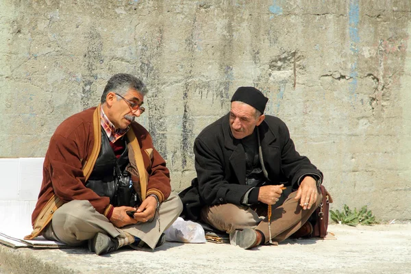 stock image Turkish men chatting sitting at a wall