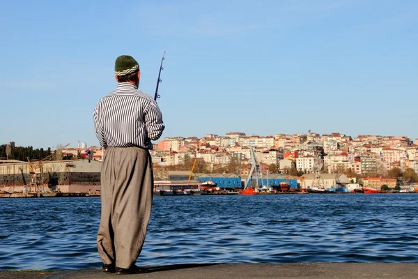 Pesca do pescador na cidade — Fotografia de Stock