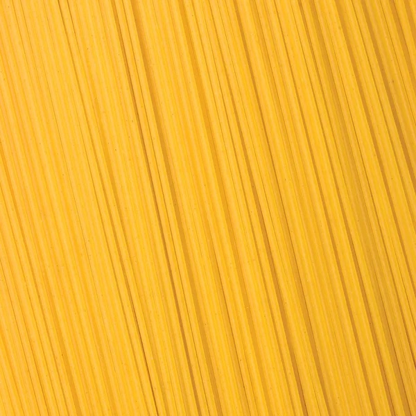 Espaguete tradicional macarrão close-up fundo — Fotografia de Stock