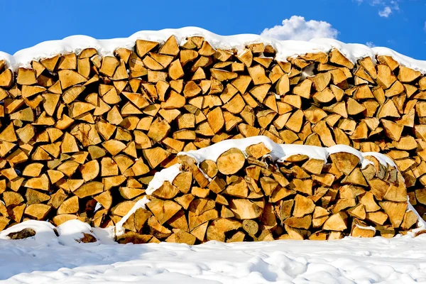 Stacked pile of firewood — Stock Photo, Image