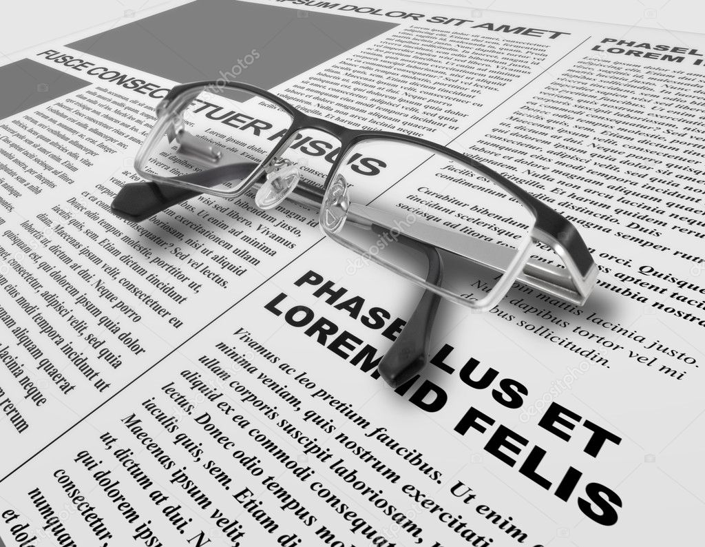 Eye glasses and newspaper