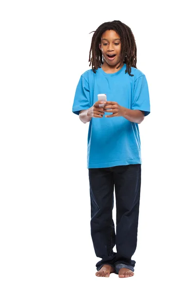 Funny rasta kid playing with cellphone in studio — Stock Photo, Image