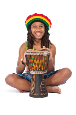 Rasta man sitting on the floor and beat a drum clipart