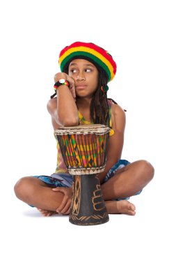 Rasta boy thinking in studio clipart