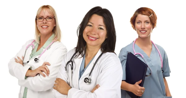 Три жінки лікарі або медсестри на білому — стокове фото