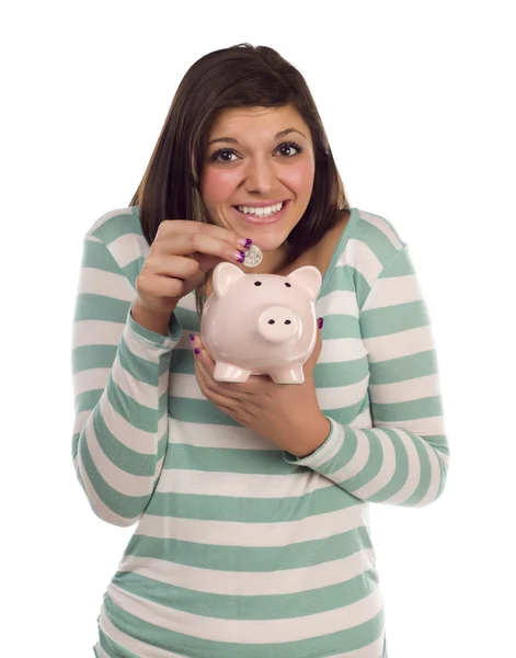 Etnia feminina colocando moeda em Piggy Bank em branco — Fotografia de Stock