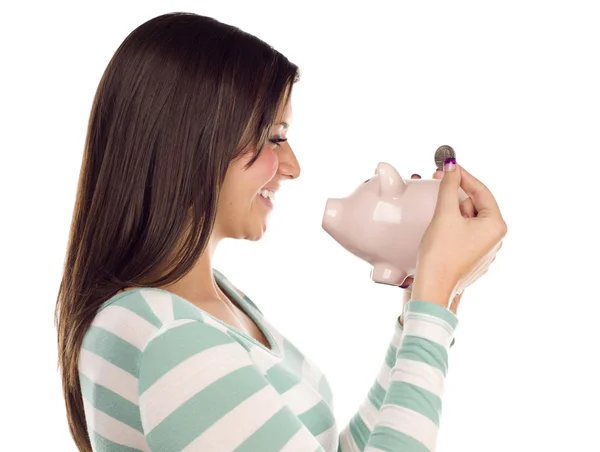 Ethnic Female Putting Coin Into Piggy Bank on White — Stock Photo, Image