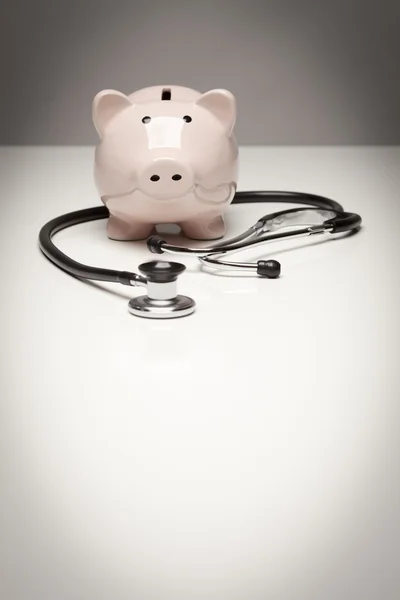 Piggy Bank and Stethoscope with Selective Focus — Stock Photo, Image
