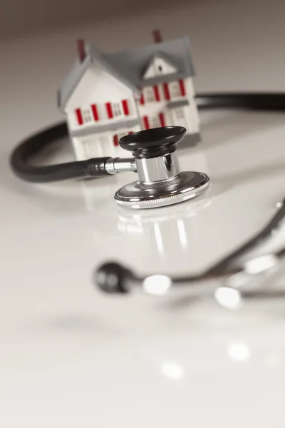 stock image Stethoscope with Small Model Home