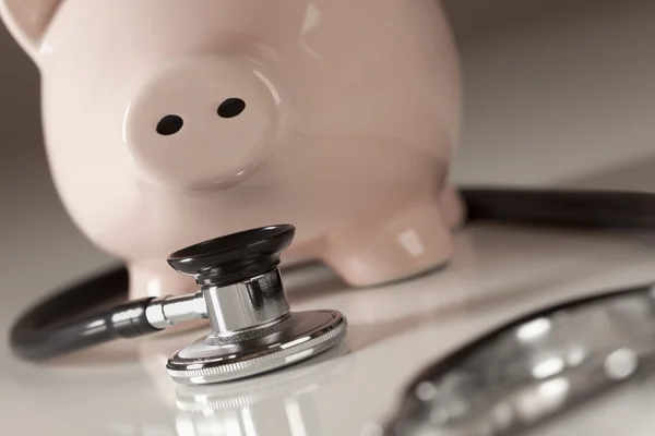 Piggy Bank and Stethoscope with Selective Focus — Stock Photo, Image