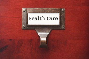 Lustrous Wooden Cabinet with Health Care File Label clipart