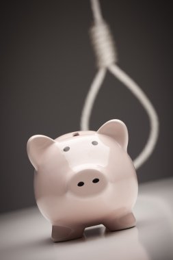 Piggy Bank with Hangman's Noose in Background clipart