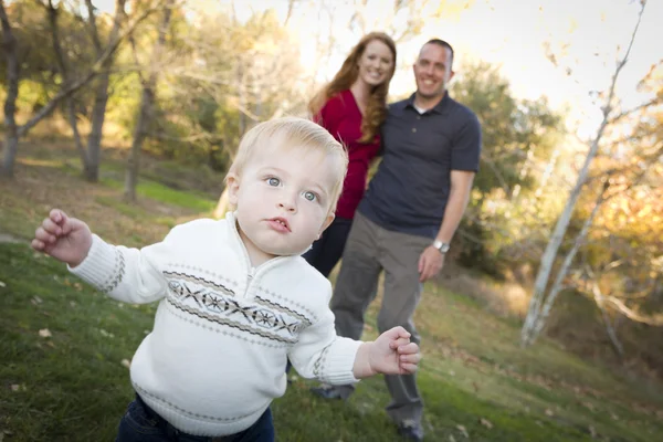 Cute Young Boy Walking as Parents Look On From Behind — Stock Photo, Image