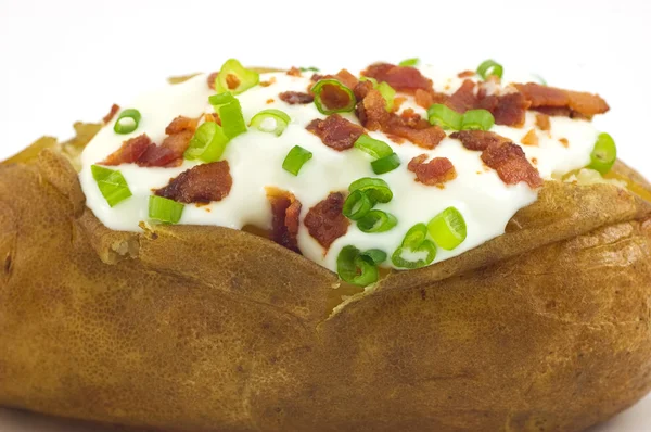 stock image Baked potato with toppings
