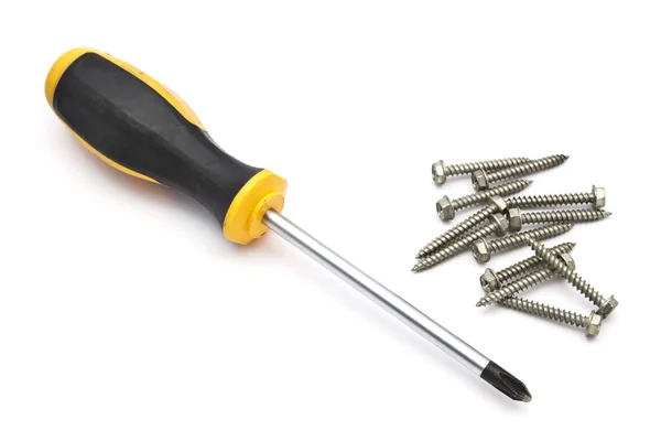 Yellow screwdriver and screws — Stock Photo, Image