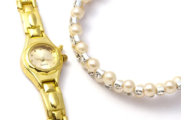 Golden wrist watch and necklace — Stock Photo, Image