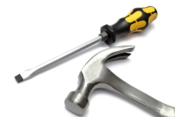 Screwdriver and hammer — Stock Photo, Image