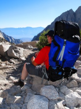 Man Hiking in Mountains clipart