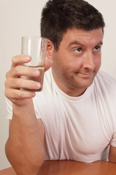 Alcoholic holding a drink — Stock Photo, Image