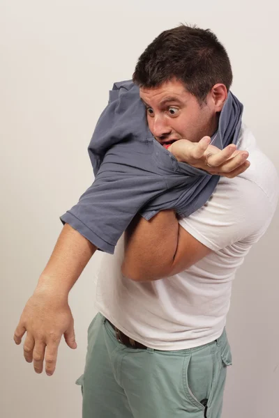 Man tangled in his shirt — Stock Photo, Image