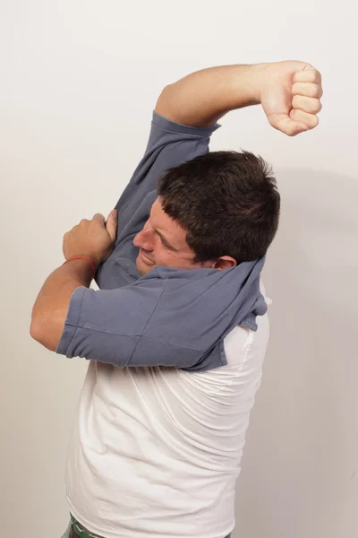 Man stuck in his shirt — Stock Photo, Image