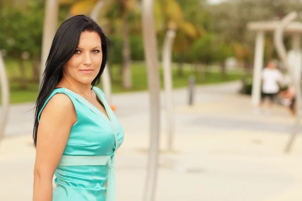 Woman in a modern blue dress — Stock Photo, Image