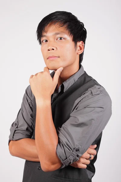 Filipino man with hand on chin — Stock Photo, Image