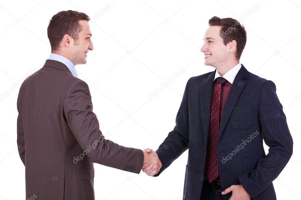 Two young businessman handshake
