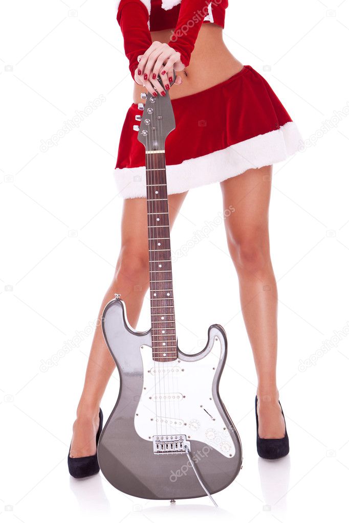Sexy legs of a santa woman with guitar