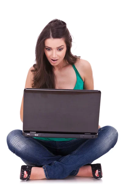 Excited college student using laptop — Stockfoto