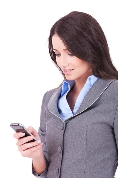 Business woman texting from her cellphone — Stockfoto