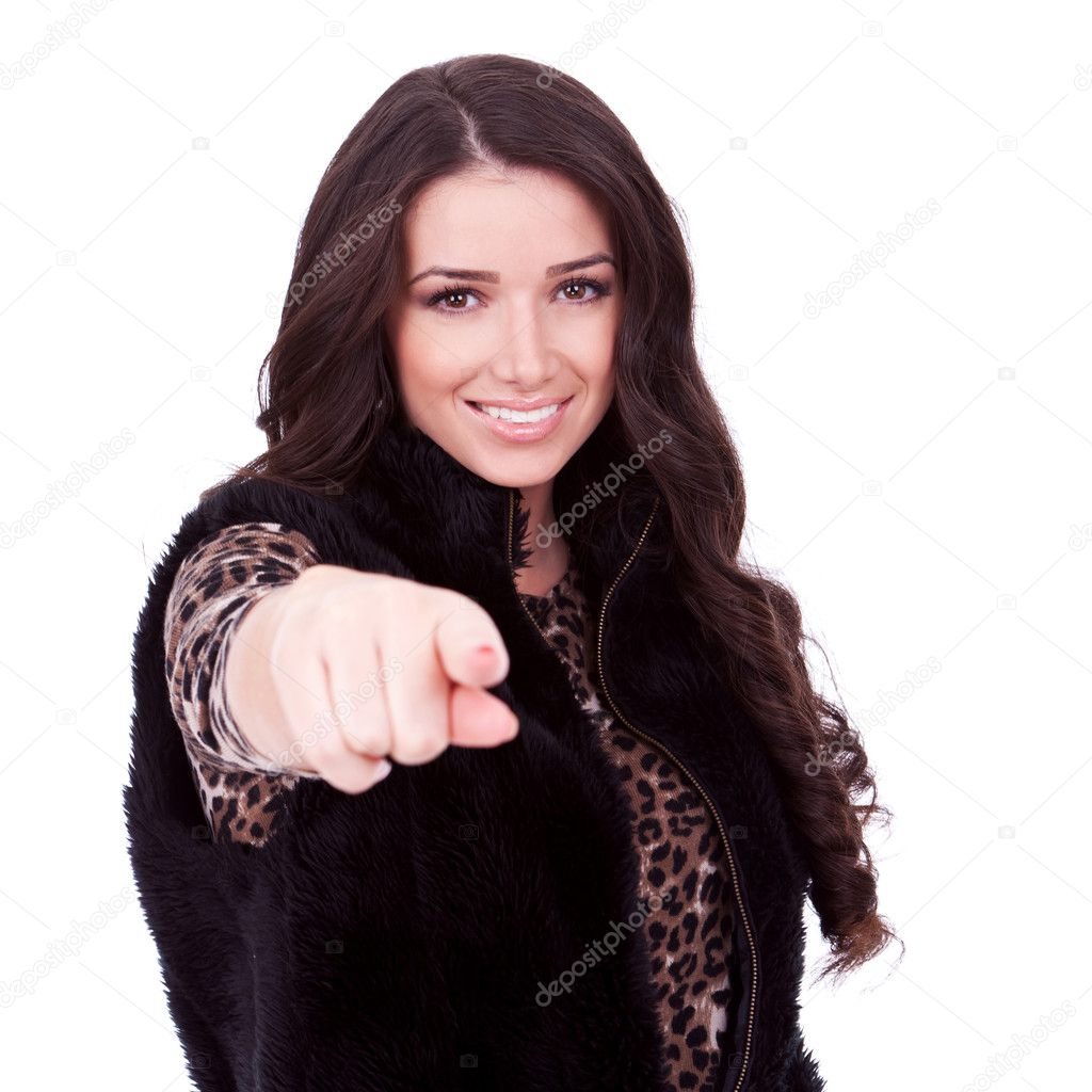 Woman in fur jacket pointing