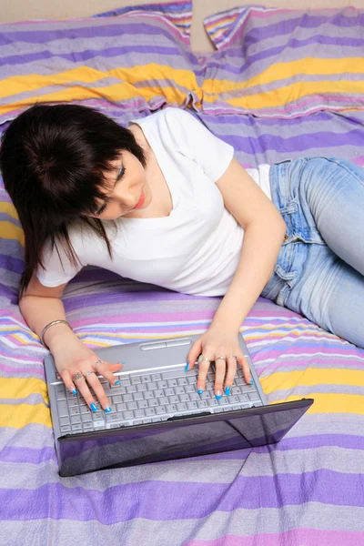 Teen girl in her bed — Stock Photo, Image