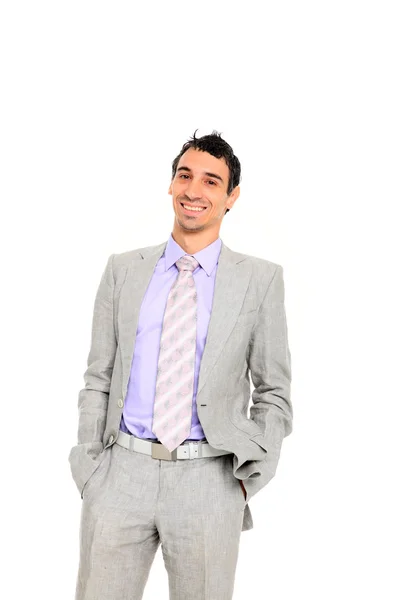 Young business man standing with hands in pocket — Stok fotoğraf