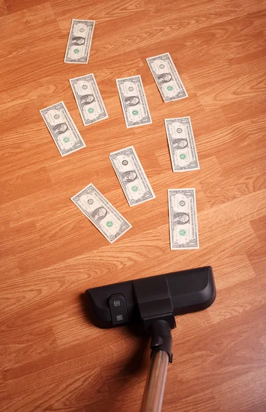 Пылесос с деньгами — стоковое фото