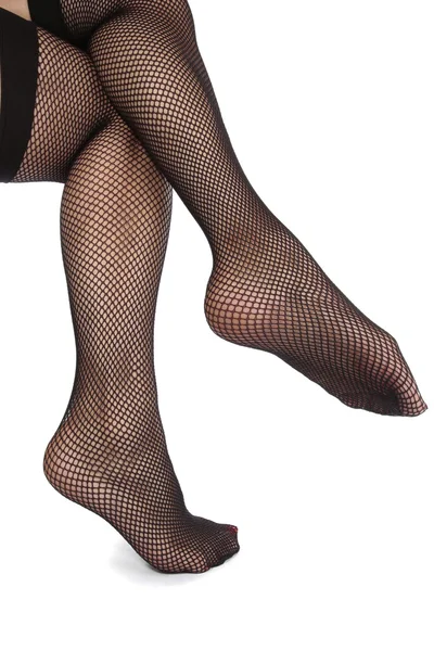 Mujer piernas usando mallas sobre fondo blanco — Foto de Stock