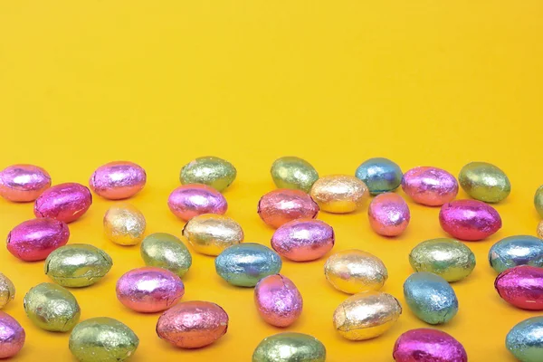 Easter eggs and over yellow — Stock Photo, Image