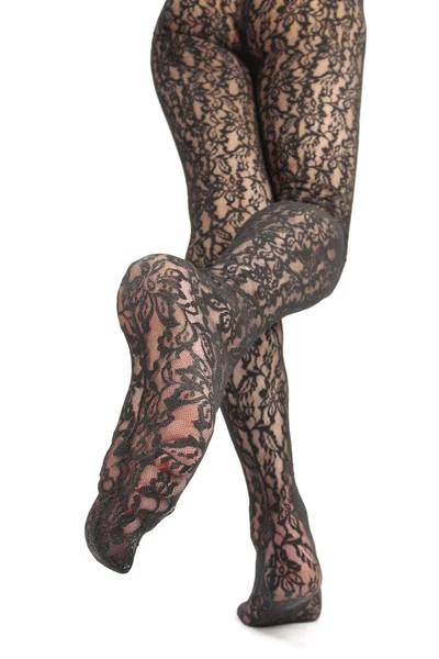 Женские ноги в колготках на белом фоне — стоковое фото