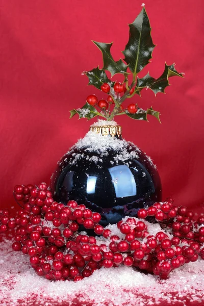 Christmas decorations over red background — Stock Photo, Image