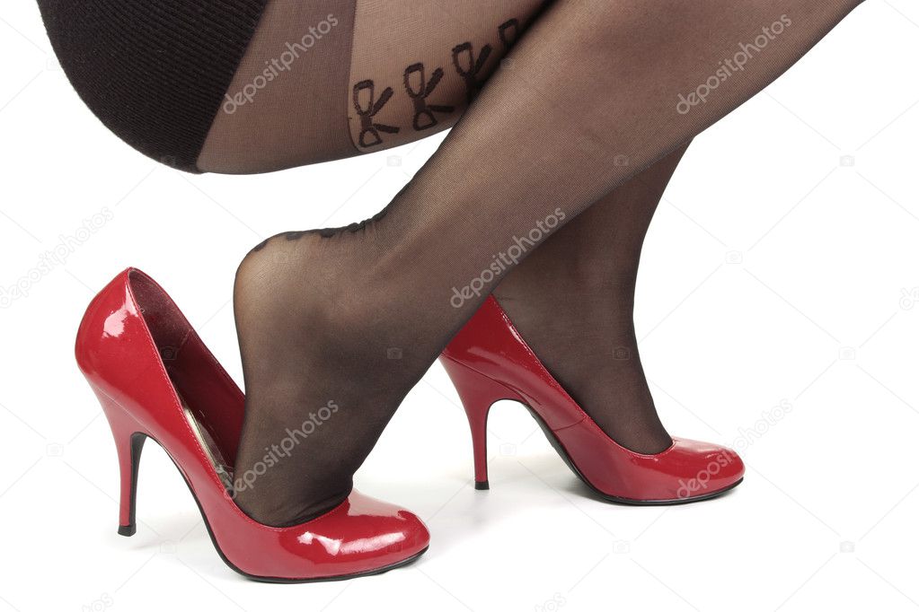 Woman legs wearing red heel shoes & tights