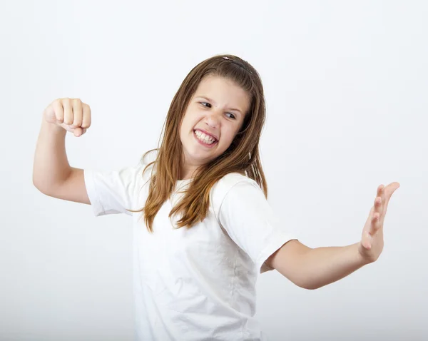 Angry girl prepares to strike open hand with clenched fist. — Stock Photo, Image